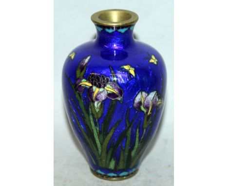 A SMALL JAPANESE MEIJI PERIOD CLOISONNE VASE, the sides decorated with butterflies and iris in opaque enamels reserved on a t