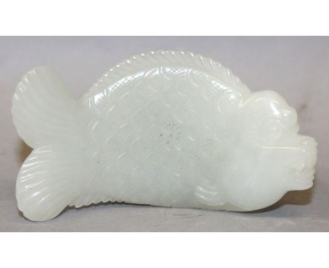 A FINE QUALITY 19TH/20TH CENTURY PALE CELADON CARVING OF A CHINESE MYTHICAL FISH, with curved body and naturalistically rende