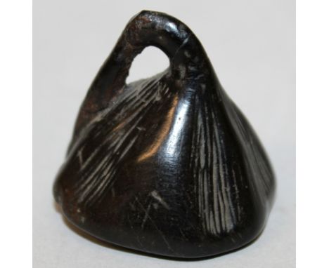 A 19TH/20TH CENTURY CARVED WOOD NETSUKE OF A LOTUS POD, 1.4in high.