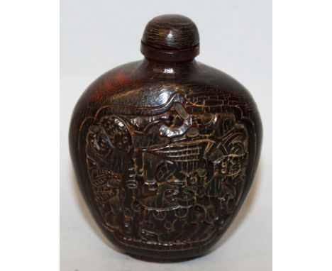 A GOOD 19TH CENTURY CHINESE HORN SNUFF BOTTLE & STOPPER, carved to one side with a panel of Shou Lao in the company of a deer