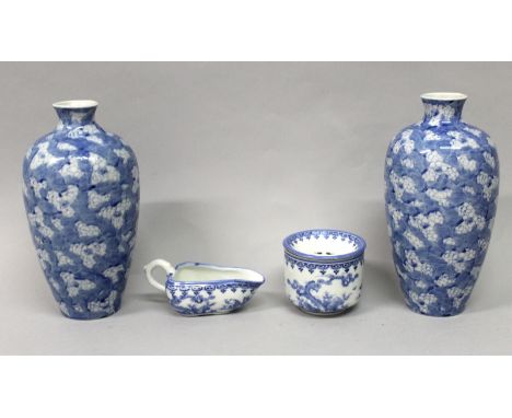 AN EARLY 20TH CENTURY JAPANESE BLUE & WHITE HIRADO PORCELAIN SAUCEBOAT, painted with playing boys; 5.5in long; together with 