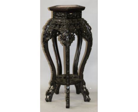 A GOOD QUALITY 19TH CENTURY CHINESE PENTAGONAL MARBLE TOP CARVED HARDWOOD STAND, the top inset with a circular marble panel, 