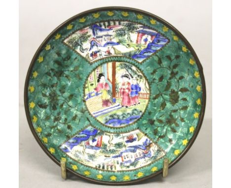 A 19TH CENTURY CHINESE CANTON ENAMEL SAUCER, decorated with figural and landscape panels reserved on a patterned green ground