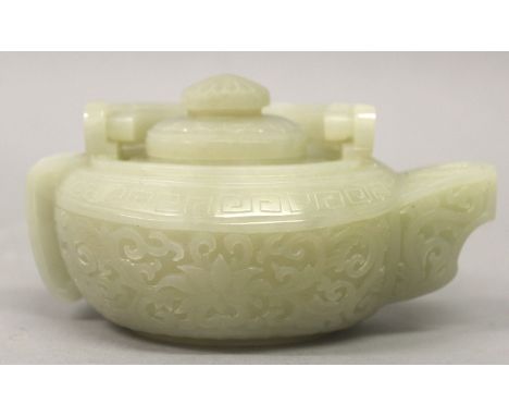 A GOOD QUALITY CHINESE CELADON JADE-LIKE EWER & COVER, the oval-section body decorated to the sides in deep relief with forma