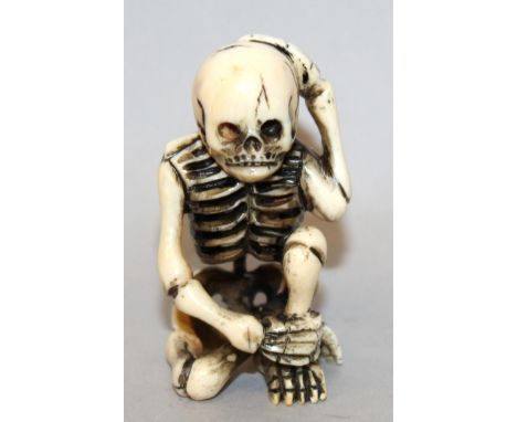 A GOOD SIGNED JAPANESE MEIJI PERIOD IVORY NETSUKE OF A SKELETON BY MATSUYAMA, the skeleton in a kneeling posture with one han