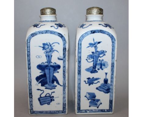 A GOOD PAIR OF CHINESE EARLY KANGXI BLUE & WHITE PORCELAIN FLASKS, late 17th Century, with silver-metal covers, each square s