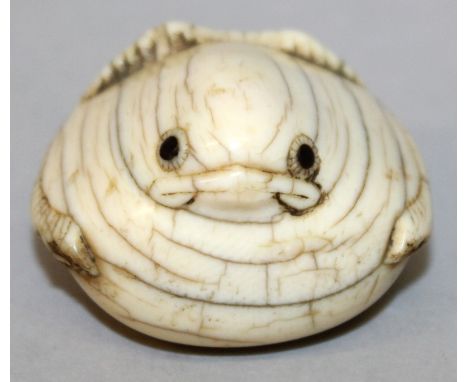 A RARE 18TH CENTURY JAPANESE EDO PERIOD IVORY NETSUKE OF THE TONGUE CUT SPARROW BY GENKO, the bird with inlaid eyes, the base