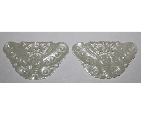 A GOOD PAIR OF 18TH/19TH CENTURY PALE CELADON JADE BUTTERFLY PLAQUES, each with pierced wan swastika and lotus decoration, th