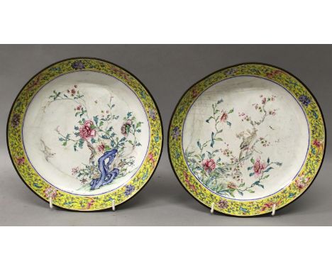 A PAIR OF 18TH CENTURY CHINESE QIANLONG PERIOD CANTON ENAMEL SAUCER DISHES, each interior decorated with a scene of birds and