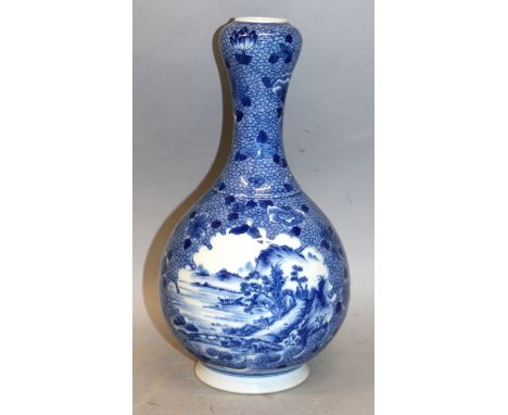 A GOOD QUALITY CHINESE BLUE & WHITE PORCELAIN BOTTLE VASE, the sides decorated with two detailed shaped river landscape panel