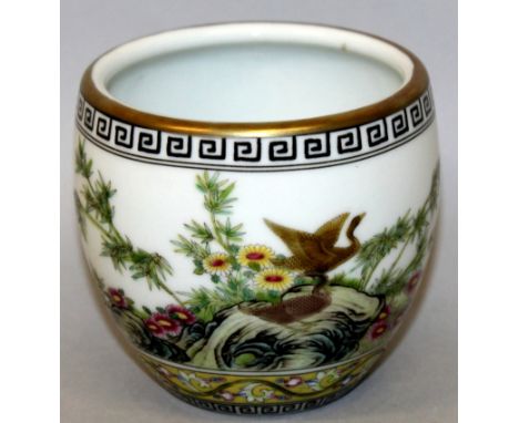 A SMALL CHINESE FAMILLE ROSE PORCELAIN POT, the sides decorated with a continuous garden scene of wild geese, foliage and roc