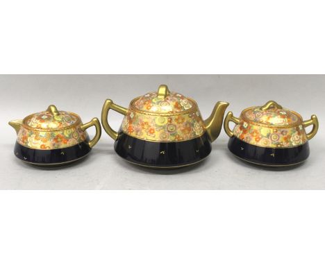 AN EARLY 20TH CENTURY JAPANESE SATSUMA EARTHENWARE PART TEA SERVICE, comprising a teapot and cover, a milk jug and cover, and