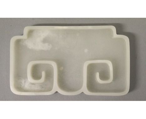 A CHINESE WHITE JADE-LIKE BRUSHWASHER, the interior with raised key-fret, 3.6in x 2.1in x 0.4in high. 