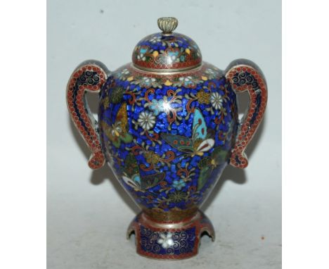 ANOTHER EARLY 20TH CENTURY JAPANESE CLOISONNE VASE & COVER, supported on a splayed shaped foot, the sides set with double scr