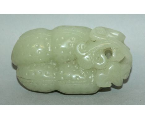A CHINESE PIERCED CELADON JADE-LIKE GROUP, in the form of stippled gourds and lingzhi, 3.25in long. 