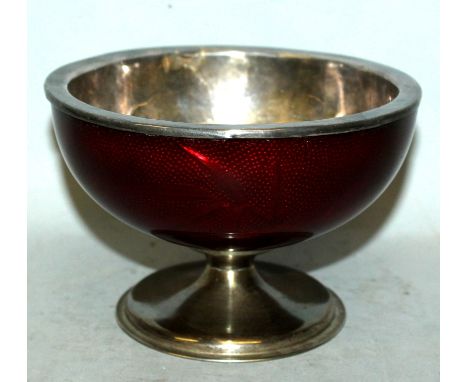 AN EARLY 20TH CENTURY JAPANESE GIN BARI RED ENAMEL BOWL, with silver-metal liner, the sides decorated beneath the translucent