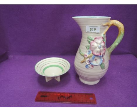 A Newport pottery Clarice Cliff ribbed jug having naturalistic branch and floral pattern and a Wilkinson Clarice Cliff sucre 