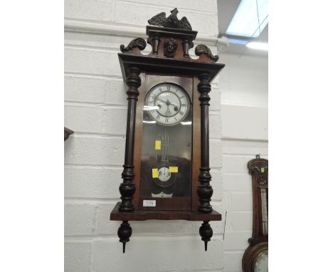 A late 19th/early 20th Century mahogany cased Vienna style wall clock