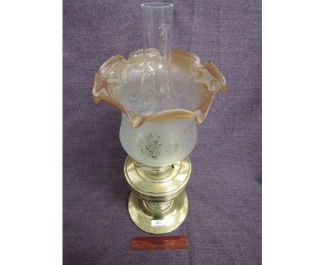 A 19th century brass frame oil lamp having later fluted shade