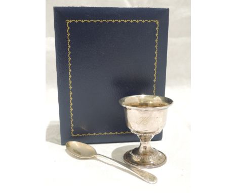 A cased silver egg cup and spoon of plain form bearing monogram K,  Birmingham 2001, W I Broadway &amp; Co