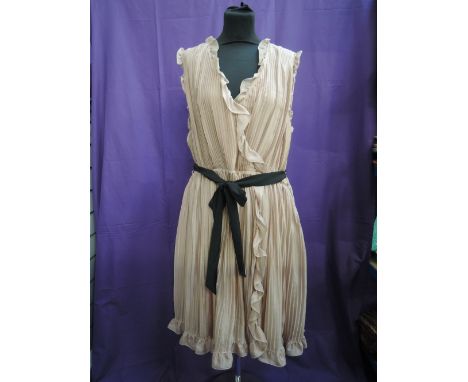 A lady's dusky pink knife pleat cross over silk dress by Jaeger having black sash tie and frill detail,  size 16 with label a