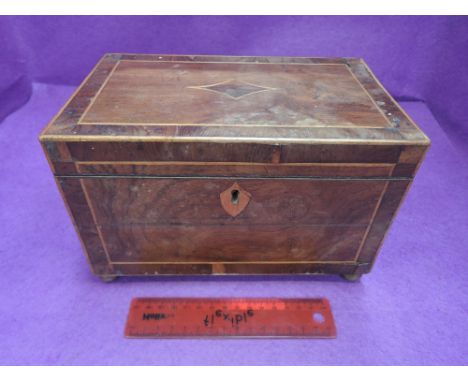 A 19th century mahogany tea caddy having line inlay, with brass handles and ball feet