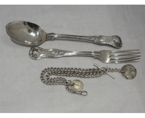 A Georgian silver dessert spoon and matched Victorian silver dessert fork in Kings pattern, London 1834/1842 and an HM silver