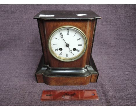 A late Victorian/Edwardian mantel clock having mahogany and ebonised case with circular Roman numeral dialAppears ok but we d