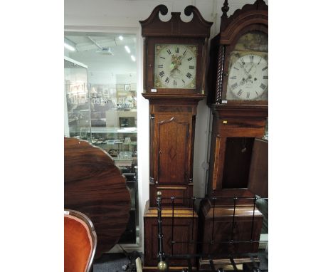 A late 18th century oak and mahogany longcase clock having swan neck and inlay hood with reeded columns containing painted di