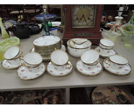 A Wedgwood part tea service in gilt heightened floral pattern