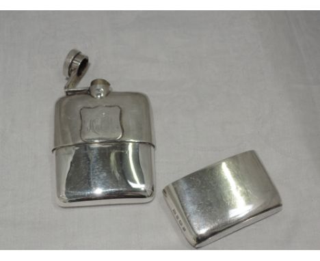 A silver hip flask of plain form having monogrammed shield cartouche, bayonet hinged lid and removable stirrup cup, Birmingha