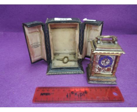 An Edwardian Swiss miniature carriage clock by Golay, Geneve having brass Oriental case and enamelled porcelain naturalistic 