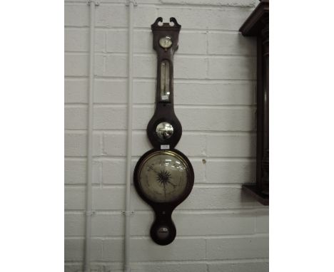 A 19th century mahogany wheel barometer having humidity and thermometer scales labelled, Hunter, Brixham