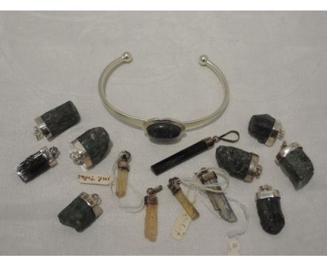 A small selection of mineral jewellery including pendants and torque bangle