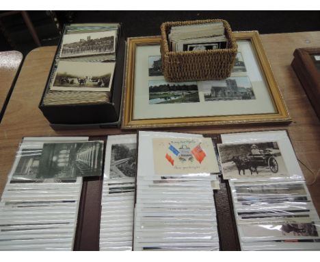 A large collection of vintage postcards, loose, in albums and framedApprox 900 cards in this lot