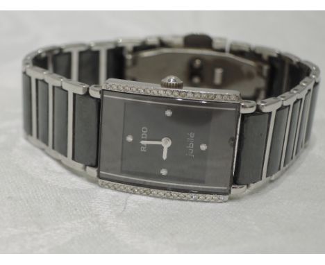 A lady's Rado Diastar Jubile wrist watch, no: 03638473, having black ceramic face with diamond set quarters and bezel on a ti