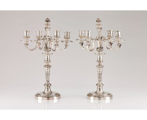 A pair of Christofle four branch candelabraSilvered metal Louis XIV style engraved and reliefs decoration  Bases with shell f