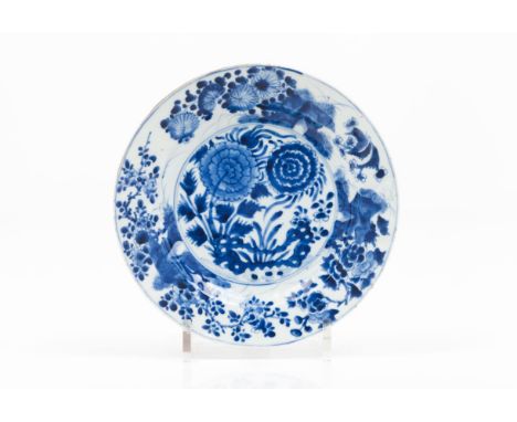 A 'chrysanthemum' plateChinese porcelain  With underglaze blue decoration depicting chrysanthemums and other flower motifs Ka