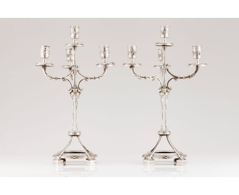 A pair of four branch candelabraPortuguese silver Neoclassical decoration shaft with grooves, crossed ribbons and acanthus le