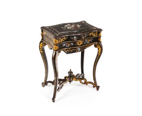 A Napoleon III work tableEbonised wood Gilt and mother-of-pearl floral and foliage decoration Tilting-top Lined interior with