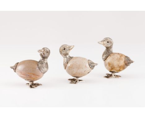 A group of three ducksSilver Moulded, engraved and chiselled resting onto egg shaped hardstone Glass eyes Rabbit hallmark 925