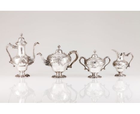 A tea and coffee setPortuguese silver Pear shaped body of profuse rocaille reliefs decoration and monogrammed cartouche Flute