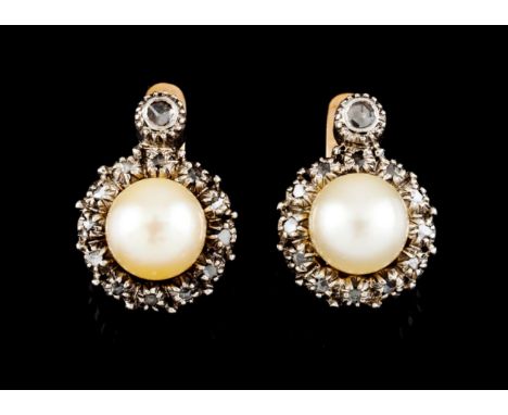 A pair of earringsGold and silver Cultured pearl (ca. 7 mm) framed by frieze set with rose cut diamonds Portugal, ca. 1950 Ma