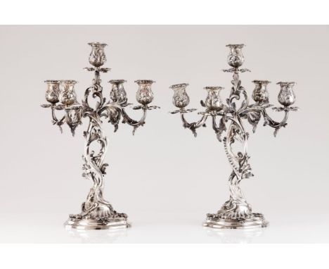 A pair of five branch candelabraPortuguese silver Profuse rococo decoration Shaft, branches, drip pans and cups of acanthus l