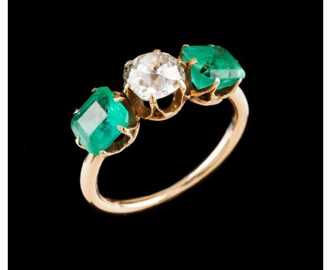 A ringGold Set with one antique brilliant cut diamond (ca. 0.90ct) and two square cut emeralds totalling (ca. 1.80ct) Europe,