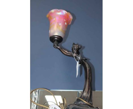 ART NOUVEAU STYLE FIGURAL LAMP modelled as a maiden in a long flowing dress holding a fluted pink glass shade aloft, 46cm hig