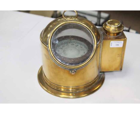 EARLY 20TH CENTURY BRASS ENCASED SHIPS COMPASS
on a revolving axis, with side chamber for an oil lamp, glass viewing window, 