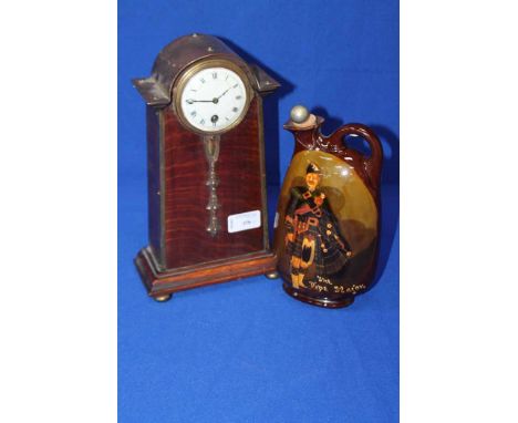 MAHOGANY AND BRASS MANTEL CLOCK
together with a royal doulton the pipe major decanter ( repaired )