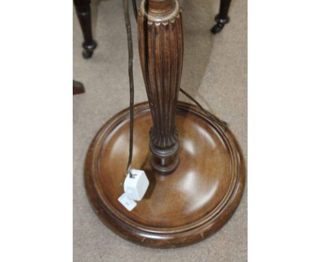 MAHOGANY STANDARD LAMP 
with turned and fluted detailing, 180cm high; along with a firescreen (2)