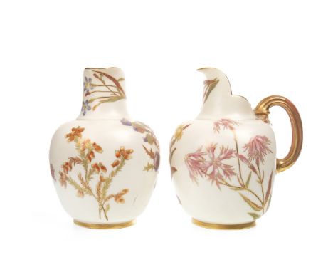 PAIR OF ROYAL WORCESTER JUGS, with reeded gilt handles, decorated with floral sprays, on a blush ivory ground, printed marks 